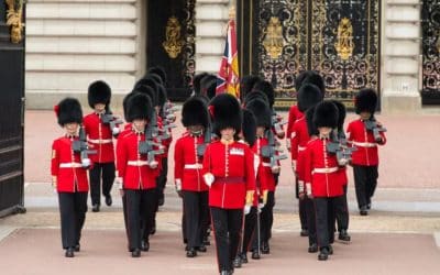 Why do the queen’s guards wear such tall hats?