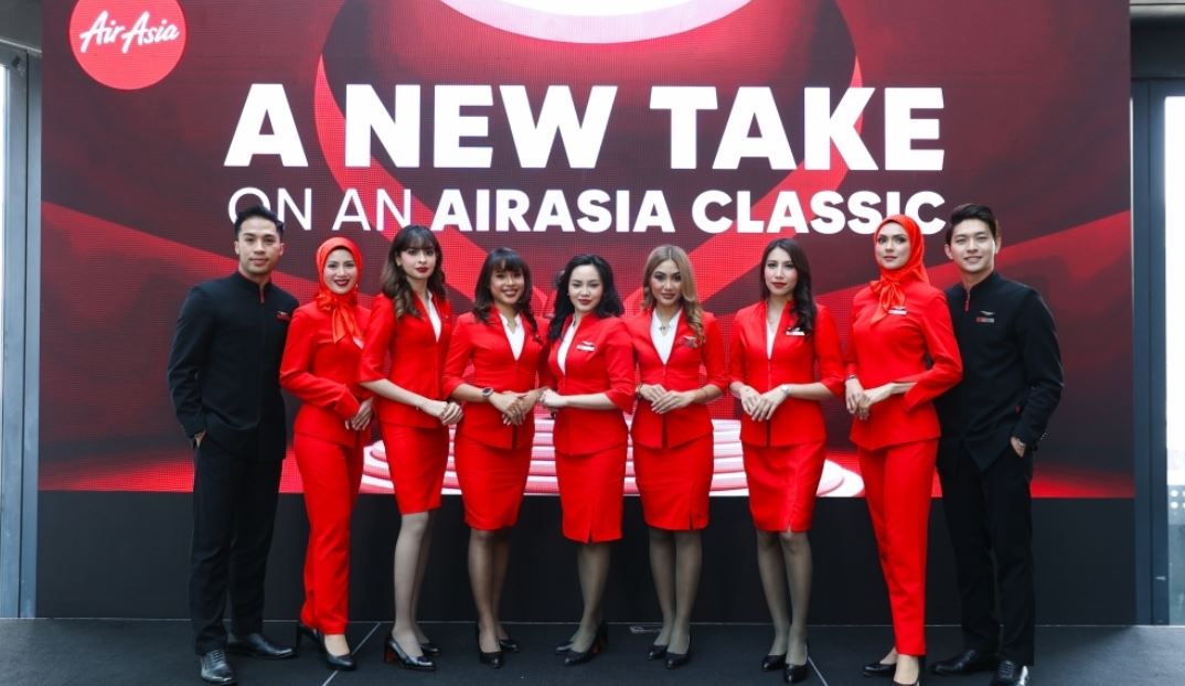 Hijab-friendly uniforms take flight as AirAsia lets its crew put their own spin on red